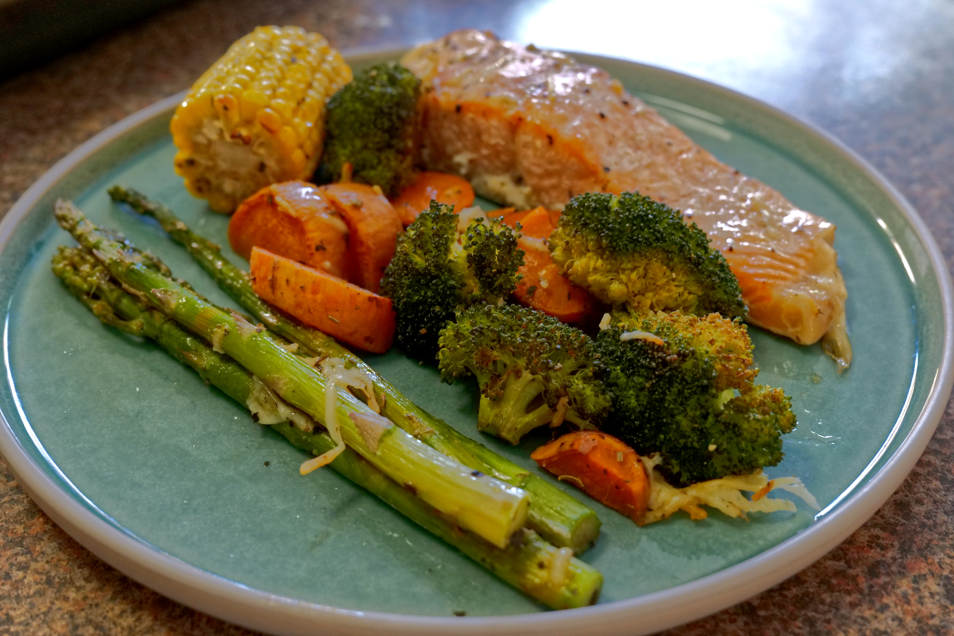 Healthy oven baked salmon and vegetables on a sheet pan